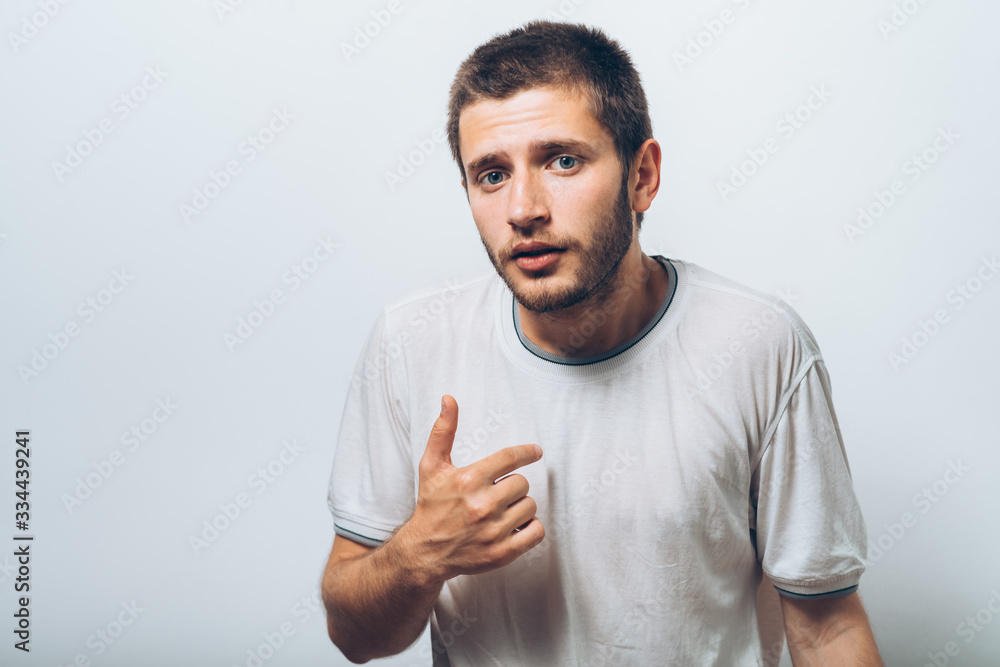 Male hand forefinger pointing to himself on the chest. Gesture. who am i. On a gray background Male hand forefinger pointing to himself on the chest. Gesture. who am i. On a gray background