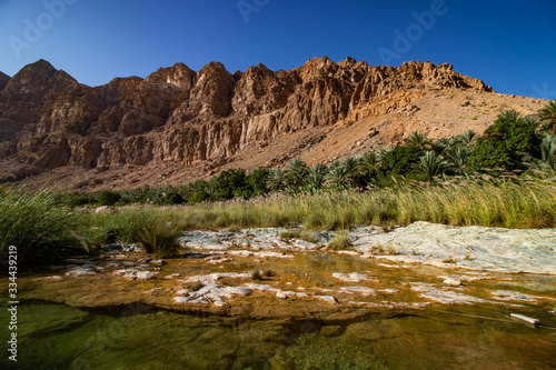Inside the narrow canyon of Wadi Tiwi at Shab near Mascat in Oman photo