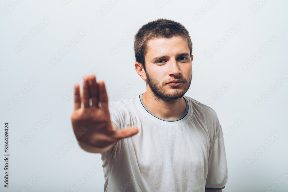 Businessman shows stop gesture Businessman shows stop gesture