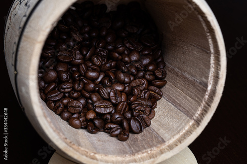 Coffee beans in blywood barrel (close up)