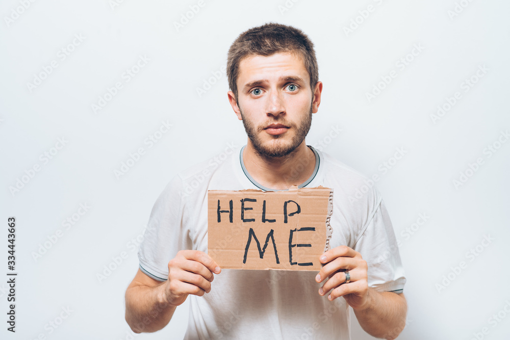 cardboard with text donate help. On a gray background. cardboard with text donate help. On a gray background.