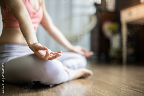 Wallpaper Mural Young asian woman practicing yoga in  bedroom.Young people do yoga indoor at home. Torontodigital.ca