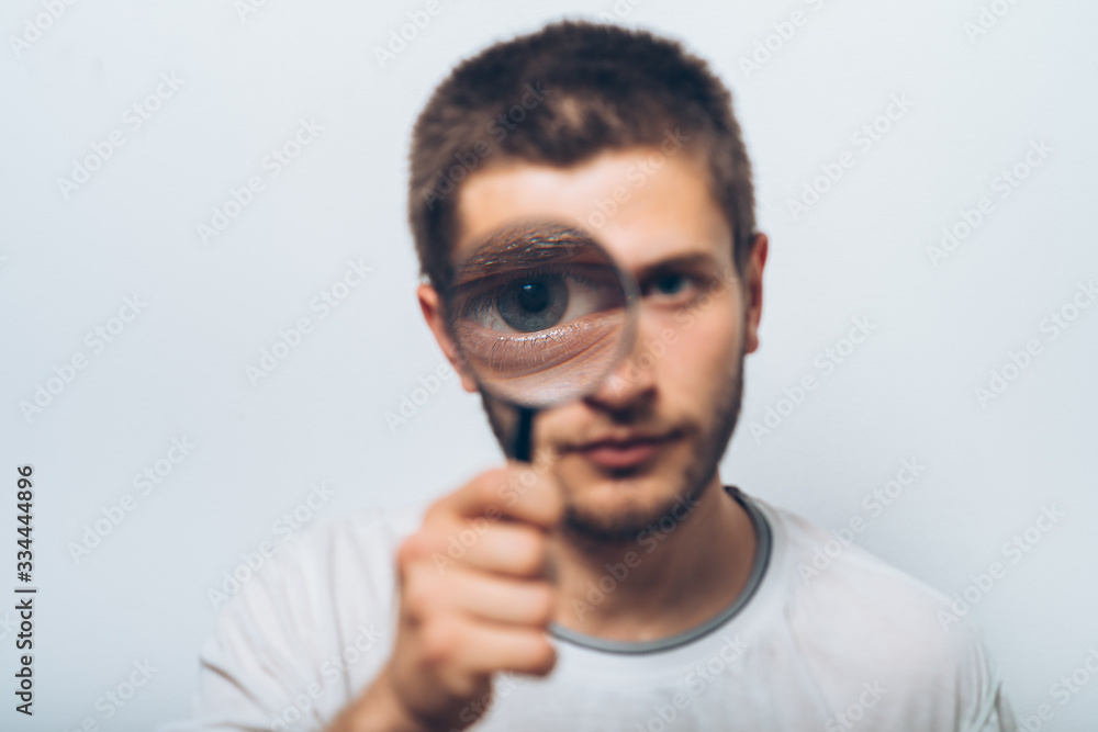 Fototapeta premium The man with a magnifier