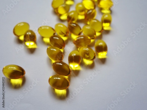 layout of yellow gelatin capsules filled with fish oil-omega 3