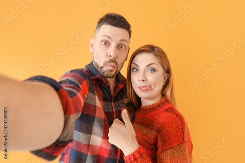 Couple taking selfie on col...