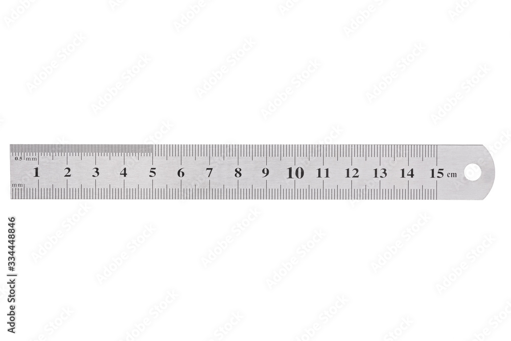 A metal ruler with a scale of up to 15 centimeters is isolated on a white background. A metal ruler with a scale of up to 15 centimeters is isolated on a white background.