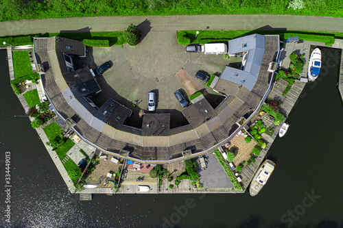 Aerial drone photo of a unique house on the river in Lemmer, Netherlands