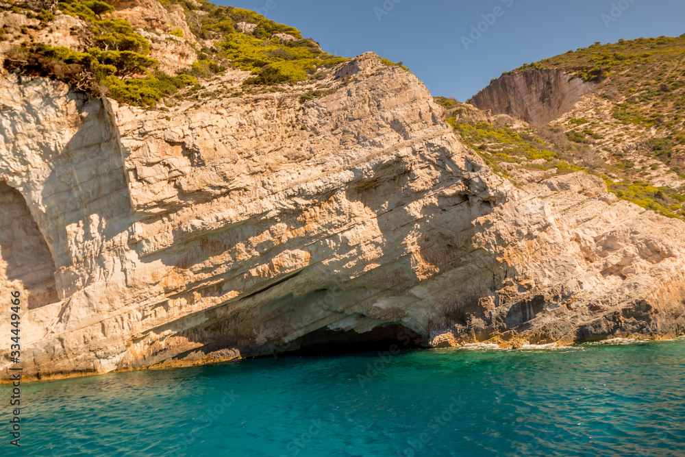 Hidden Treasure Cave just around the corner from Navagio Shipwreck in midday sun