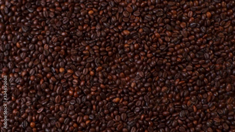Top view of hand take cup of coffee on coffee beans. Top view of hand take cup of coffee on coffee beans.