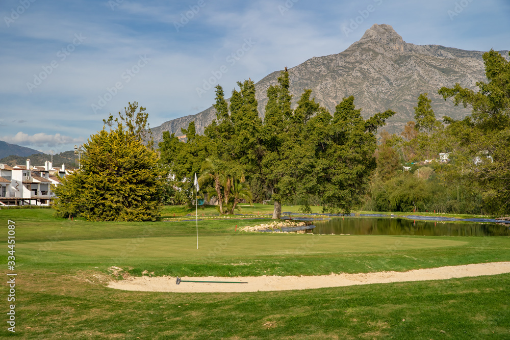 Fototapeta premium A golf course at the foot of the La Concha mountain in Spain