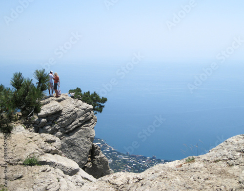 Lovely couple on aerial view of Yalta city from mountain in Crimea.