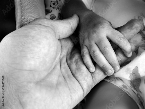 Wallpaper Mural Father and a kid holding hands together , black and white , B&W Torontodigital.ca