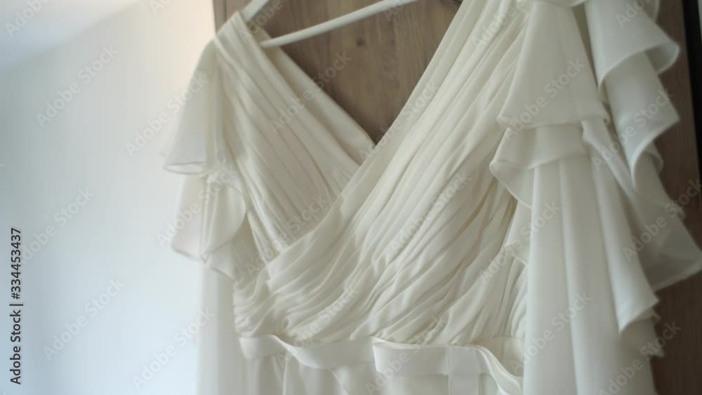 wedding dress hanging in the room wedding dress hanging in the room