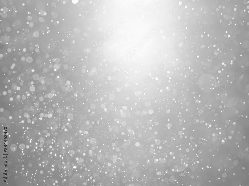 White and gray bokeh background.Abstract blur background. White bubbles on a black background. White and gray bokeh background.Abstract blur background. White bubbles on a black background.