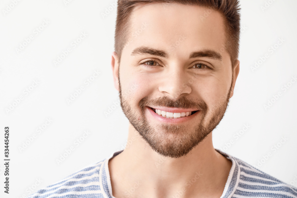 Handsome smiling young man on white background Handsome smiling young man on white background