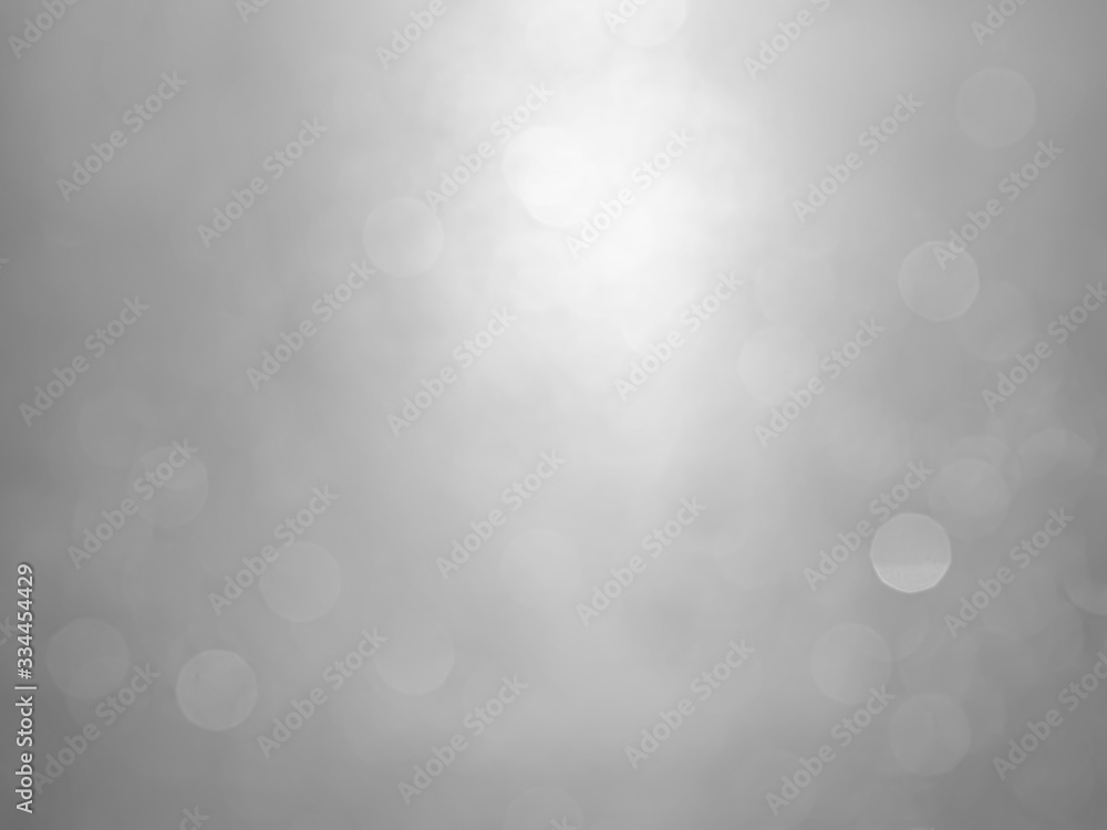 White and gray bokeh background.Abstract blur background. White bubbles on a black background. White and gray bokeh background.Abstract blur background. White bubbles on a black background.