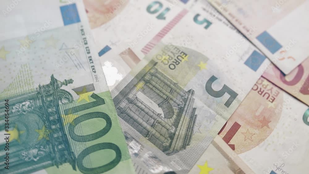 Euro banknotes gyrate or spin. Wealth, crisis, investment, success or business concept. Euro banknotes gyrate or spin. Wealth, crisis, investment, success or business concept.