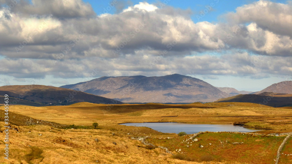 typical Irish landscape from Connemara, Galway Ireland with mountains, clouds and lakes typical Irish landscape from Connemara, Galway Ireland with mountains, clouds and lakes