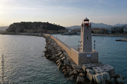 Lighthouse in the port of nice. Magnificent landscape at sunset. Shooting from the air. Landscape at sunset. © Elbor