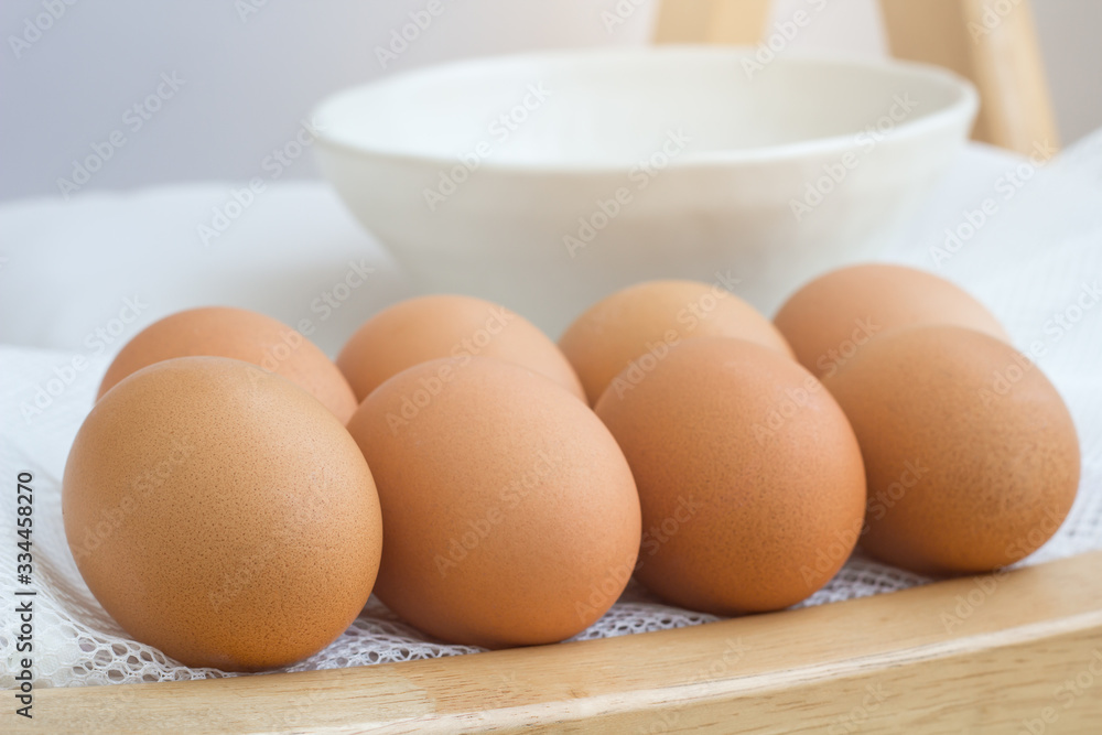 eggs on wood table on white background