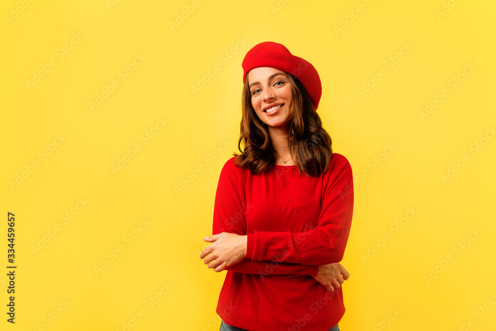 Pleasant young lady looking at camera while posing on yellow background. Studio portrait of lovely girl in red outfit chilling during photoshoot. Pleasant young lady looking at camera while posing on yellow background. Studio portrait of lovely girl in red outfit chilling during photoshoot.