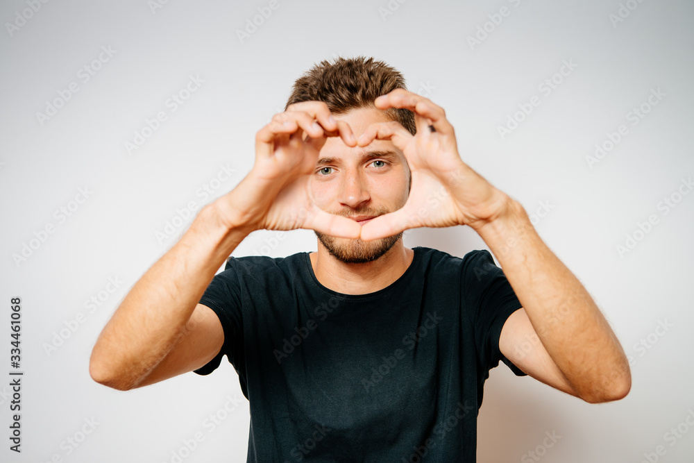 Fototapeta premium man making a hand heart frame
