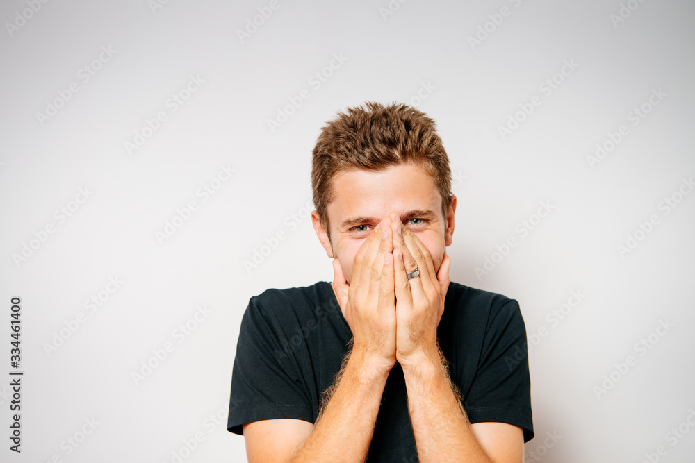 man laughs and covers her mouth man laughs and covers her mouth