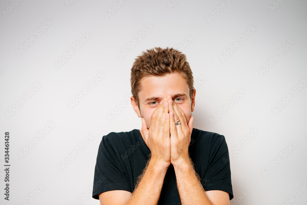 man laughs and covers her mouth man laughs and covers her mouth