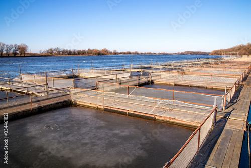 Obraz na płótnie Cages for fish farming in the natural river w salonie