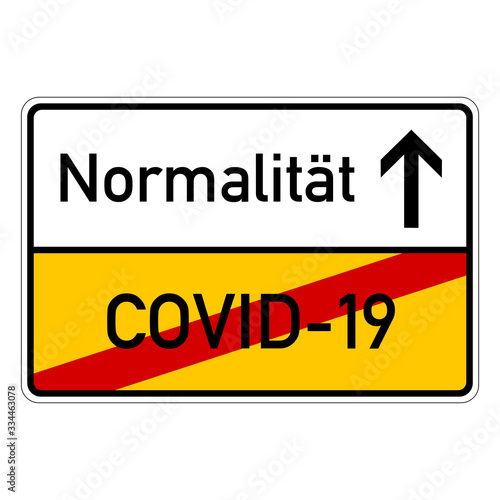 city sign with text covid-19 normalitaet