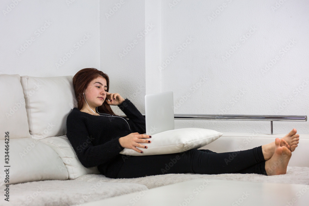 teenager watching shows on the laptop teenager watching shows on the laptop