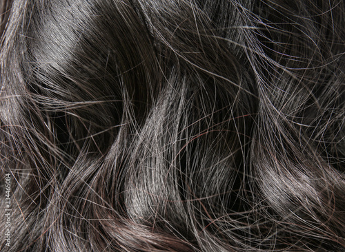 Curly dark female hair, closeup