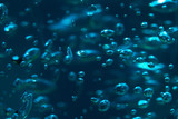 Futuristic looks background of the bubbles in blue light