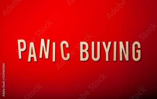 panic buying word text wooden letter on red background coronavirus covid-19