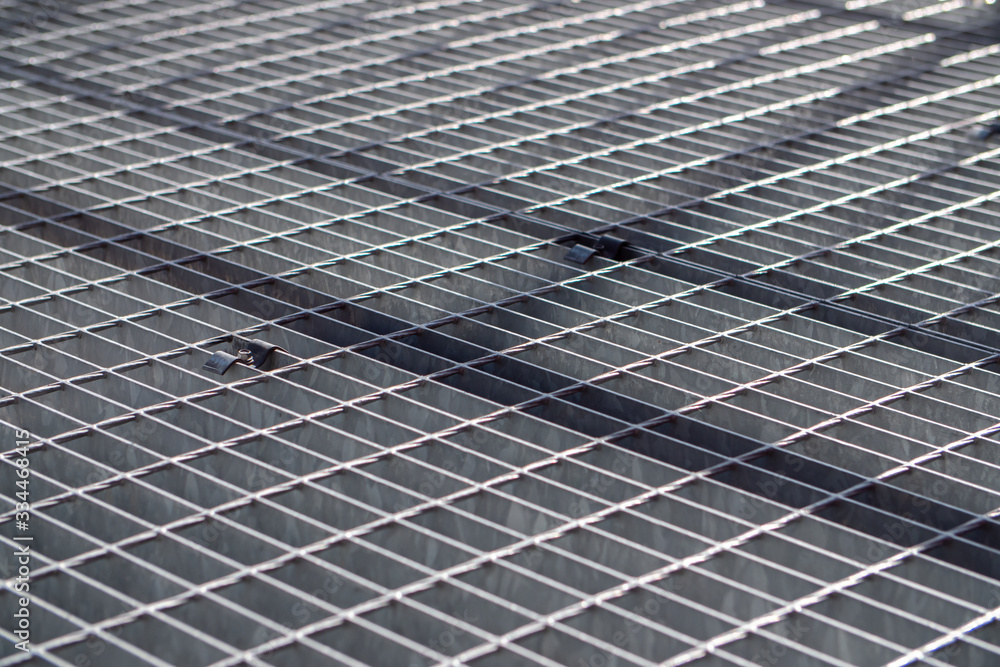 Shadow on a metal grid