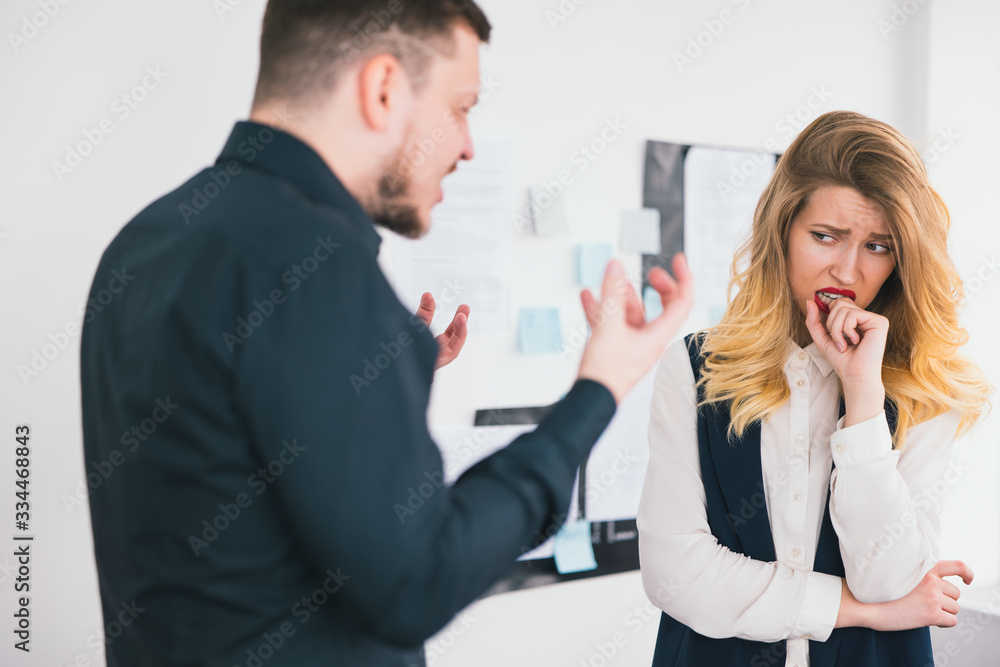 man manager got mad at his colleague woman for mistakes in documents preparation before important deal standing in modern bright office, subordinate employee conflict concept man manager got mad at his colleague woman for mistakes in documents preparation before important deal standing in modern bright office, subordinate employee conflict concept