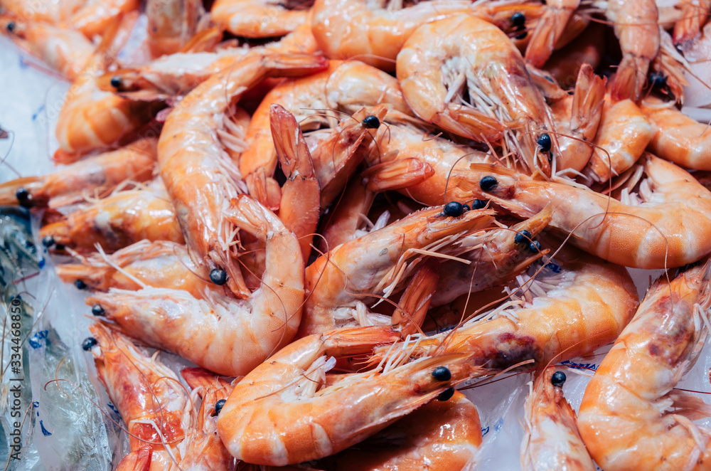 Red Prawn, shrimp, shellfish, on market stall. Mediterranean seafood. Closeup colorful photo