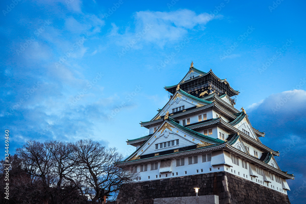 View to the Sunset Castle under Blue Sky and Trees, Japan View to the Sunset Castle under Blue Sky and Trees, Japan