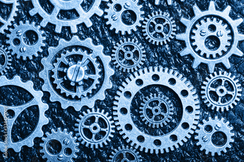 Wallpaper Mural trend color of the year 2020 classic blue. steampunk mechanical cogs gears wheels on leather background Torontodigital.ca