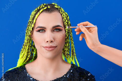 Artist applying makeup onto...