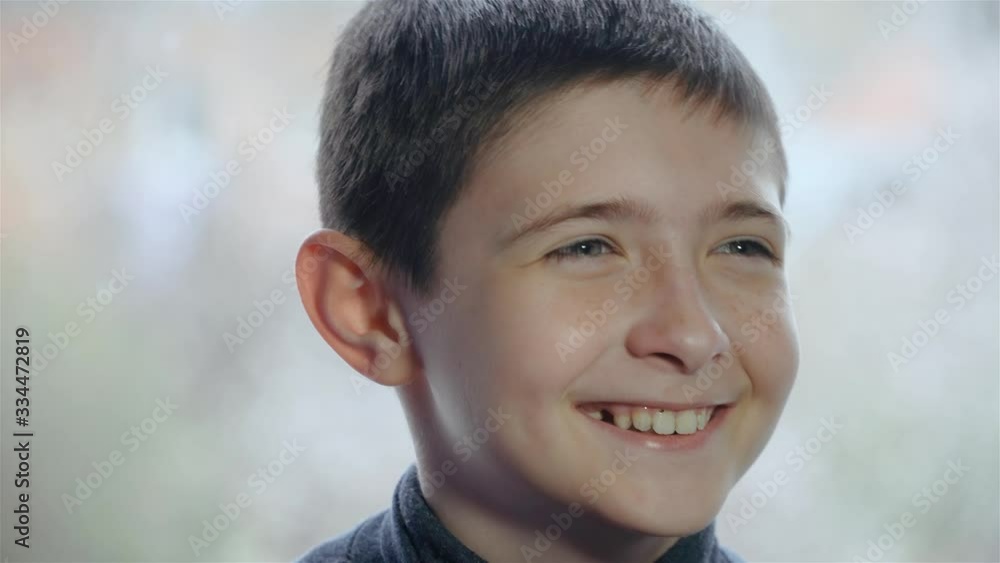 Portrait of happy carefree boy sincerely laughs with expression of joy and love on his face. Stop COVID-19 infection Portrait of happy carefree boy sincerely laughs with expression of joy and love on his face. Stop COVID-19 infection