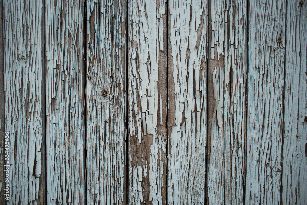 Bright wooden fence of separate wooden bars Bright wooden fence of separate wooden bars