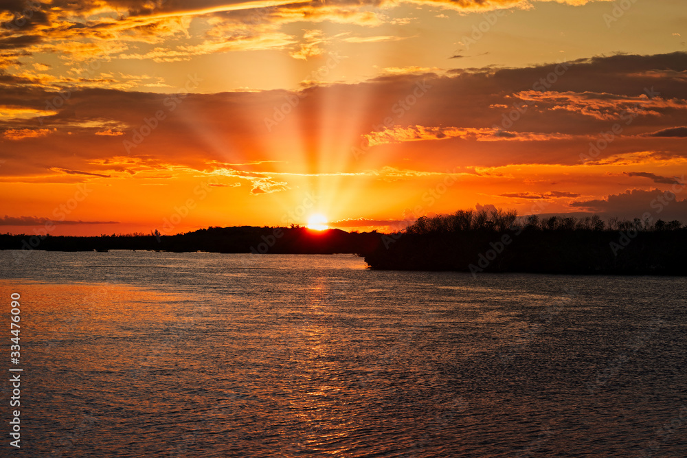 Sunset in Cayo Santa María, Cuba, the sun falls on the horizon and beautiful sun rays are formed