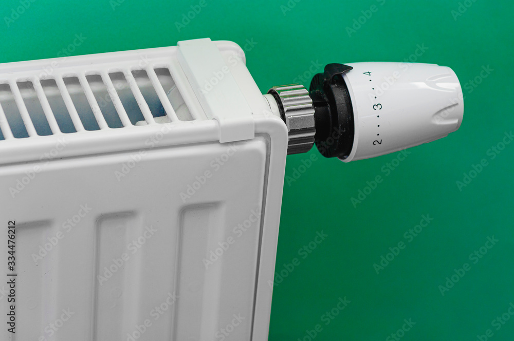 white radiator with thermostat in home white radiator with thermostat in home