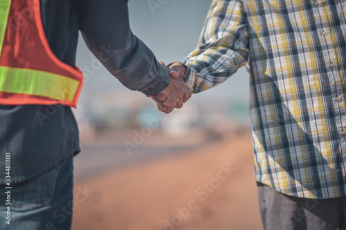 Engineer Foreman Two people are shake hands to congratulation success agreement concept,two people are partner in occupation