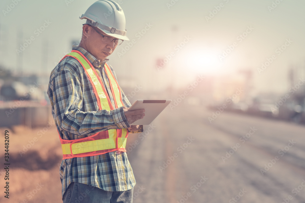 Foreman building construction hold tablet inspection work on site