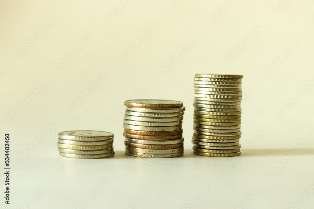Stacks of coins on a white background. Savings. Planning. Stacks of coins on a white background. Savings. Planning.