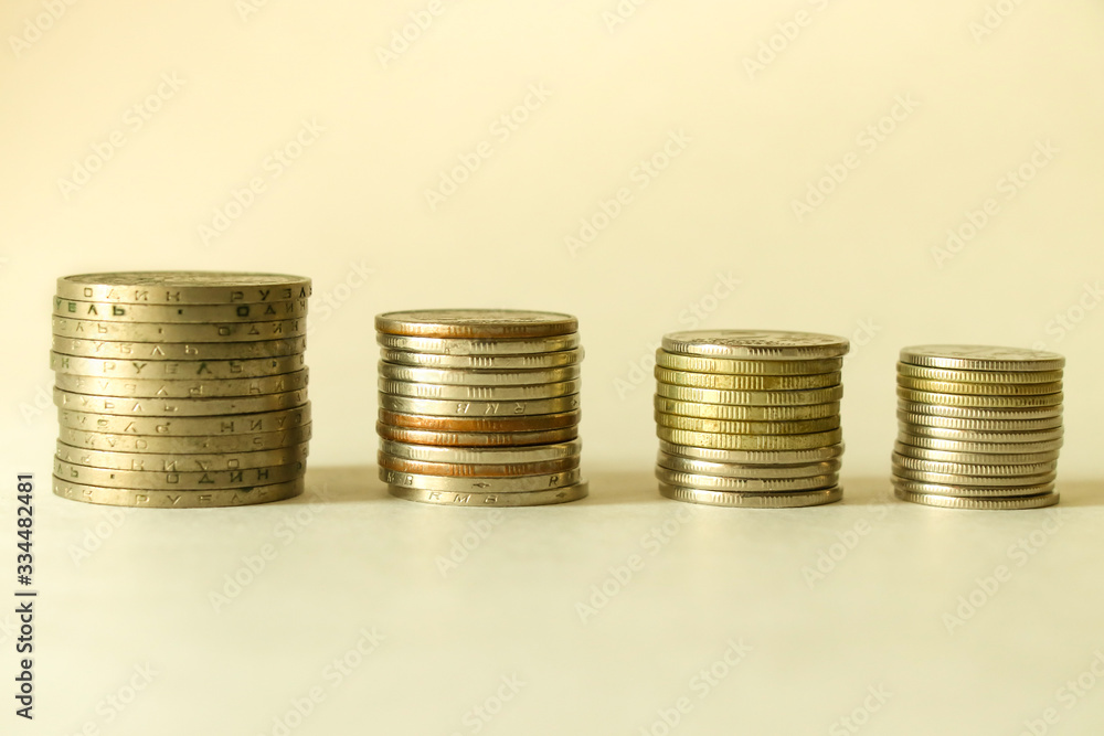 Stacks of coins on a white background. Savings. Planning. Stacks of coins on a white background. Savings. Planning.