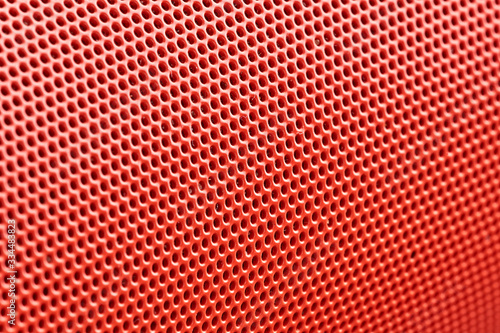 orange metal mesh in macro photography. background