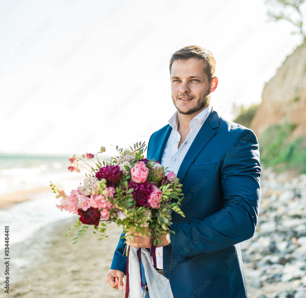 Groom getting ready in the morning for wedding ceremony on the beach Groom getting ready in the morning for wedding ceremony on the beach